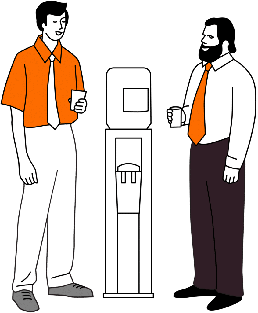 Deux personnes discutant autour de la machine à café